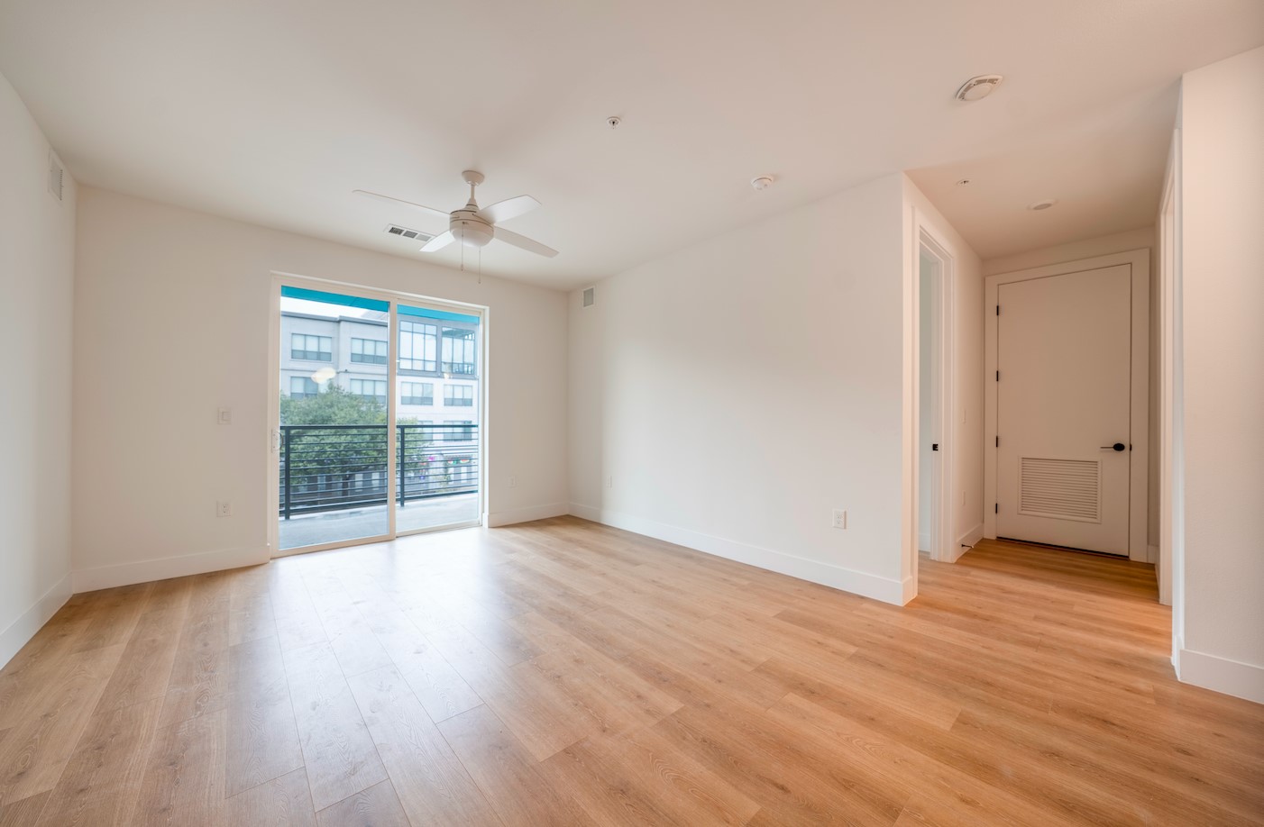 1701 Simond Avenue, Unit 212 Austin, TX 78723 - Photo 3 of 28 Empty room with light wood-style flooring and a ceiling fan