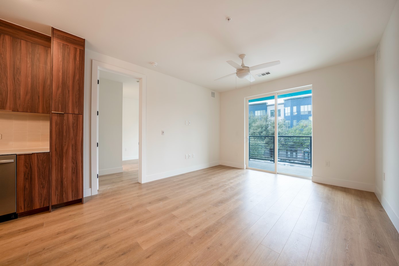 1701 Simond Avenue, Unit 212 Austin, TX 78723 - Photo 4 of 28 Spare room featuring ceiling fan and light wood-style floors