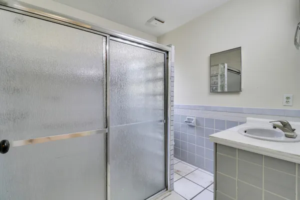 a bathroom with a sink and mirror
