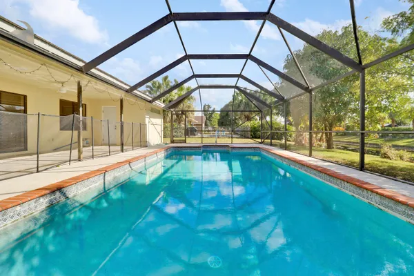 a view of swimming pool with a yard