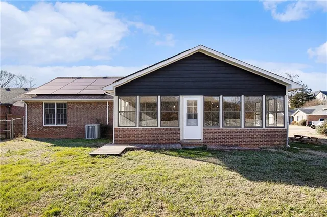 a front view of a house with a yard and porch