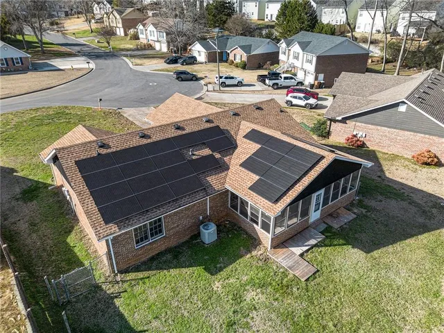 a view of a patio with table and chairs and potted plants