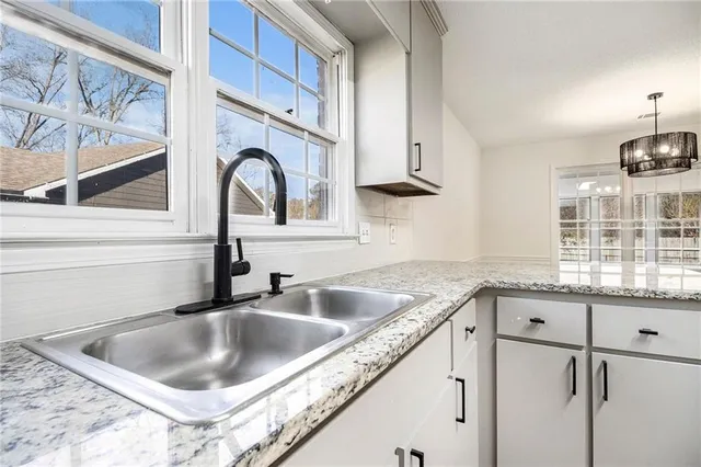 a kitchen with a sink and a window
