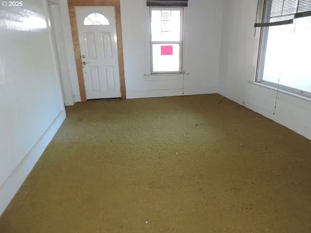 an empty room with windows