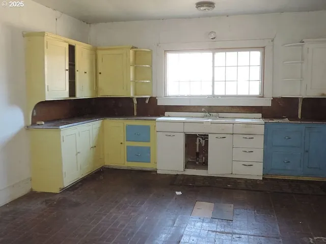 a kitchen with a sink and a stove