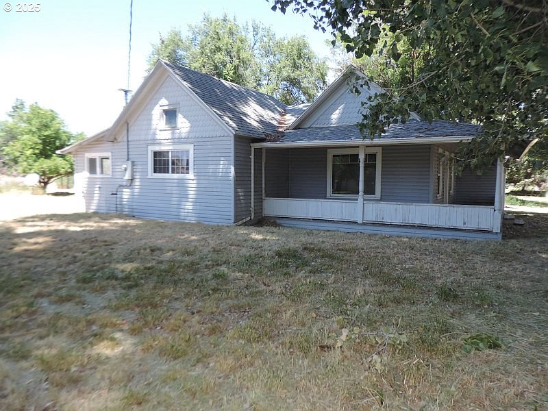 314 Northwest 2nd Street Grass Valley, OR 97029 - Photo 8 of 26 a front view of a house with a yard and garage
