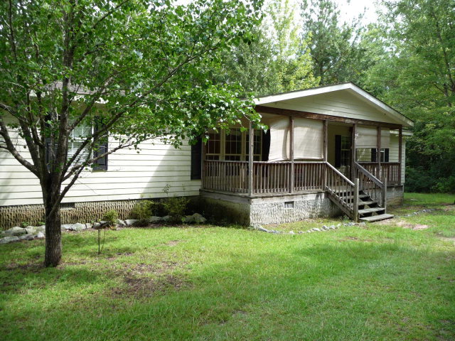 1047 County Line Road Gordon, GA 31031 - Photo 1 of 1 a view of a house with backyard and a tree