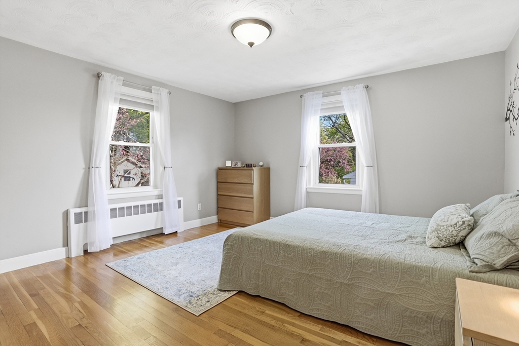 115 Collincote Street Stoneham, MA 02180 - Photo 11 of 25 a bedroom with a bed and a window