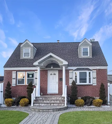 a kitchen with stainless steel appliances granite countertop a refrigerator a sink a stove a microwave and island