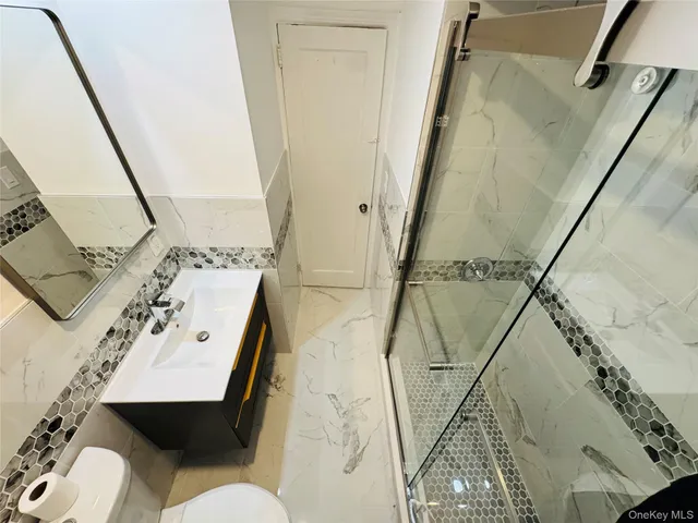 a view of a balcony with furniture and wooden floor