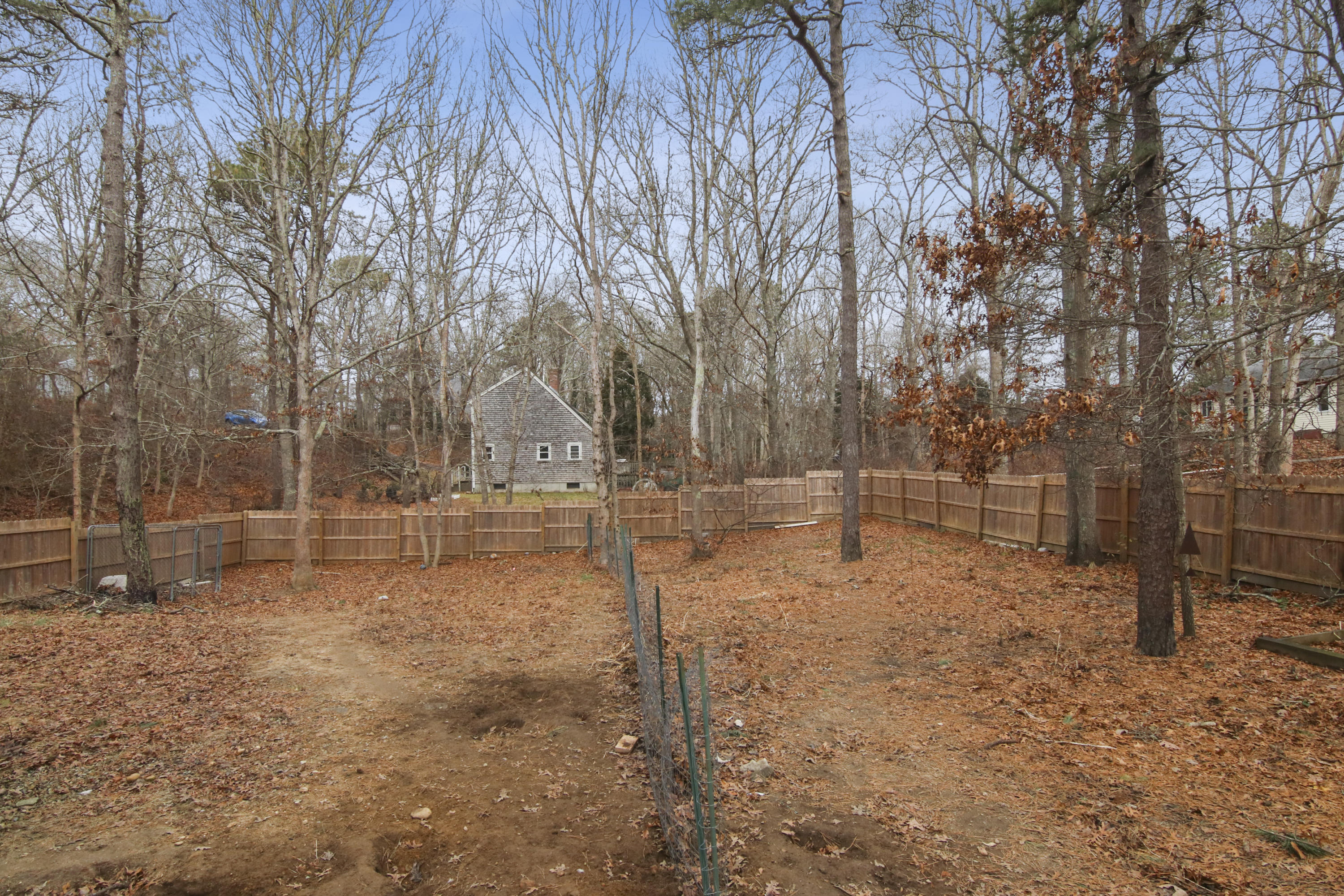 45 Blackthorn Path Forestdale, MA 02644 - Photo 18 of 19 a backyard of a house with lots of green space
