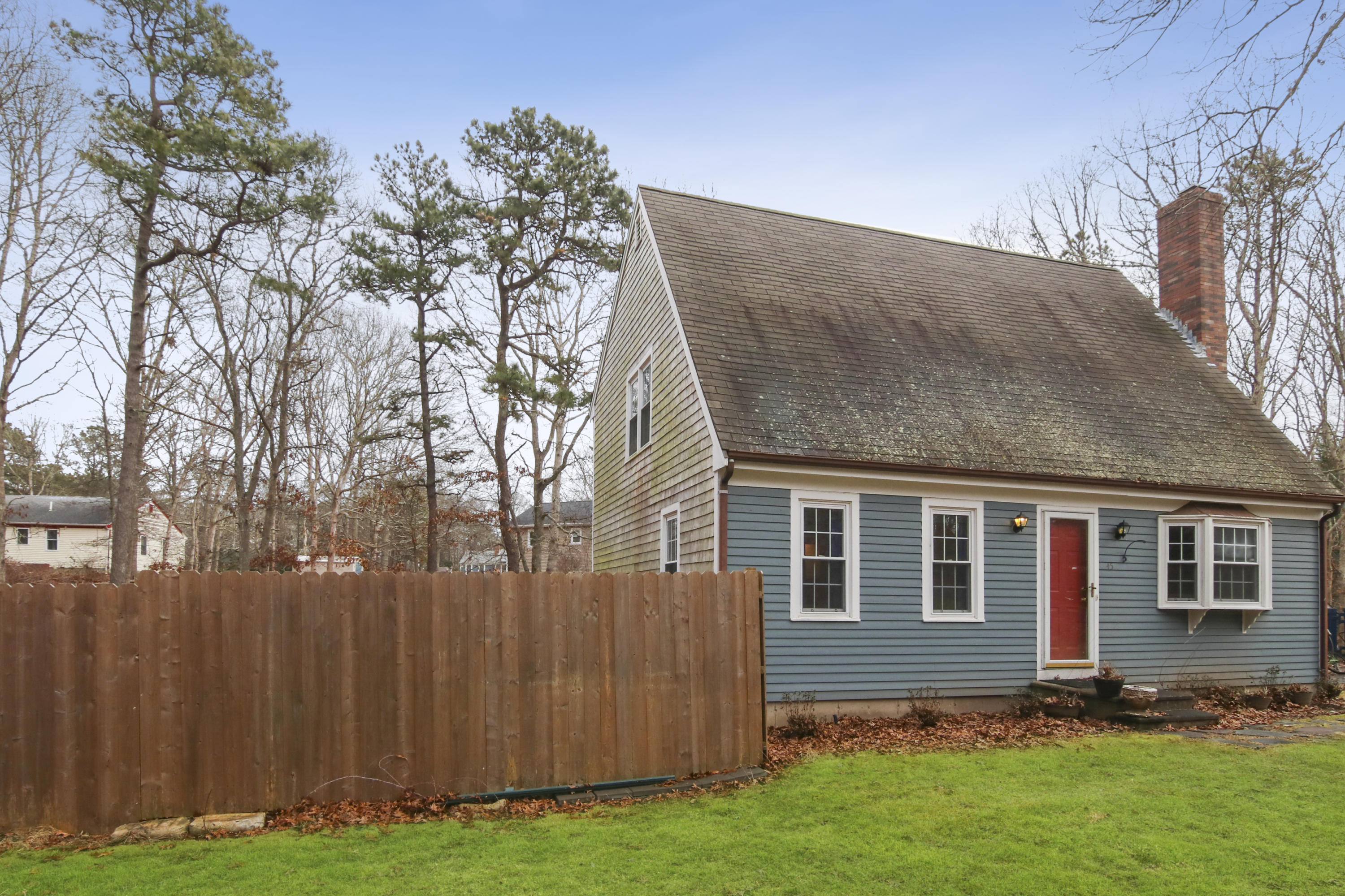 45 Blackthorn Path Forestdale, MA 02644 - Photo 3 of 19 a backyard of a house with lots of green space