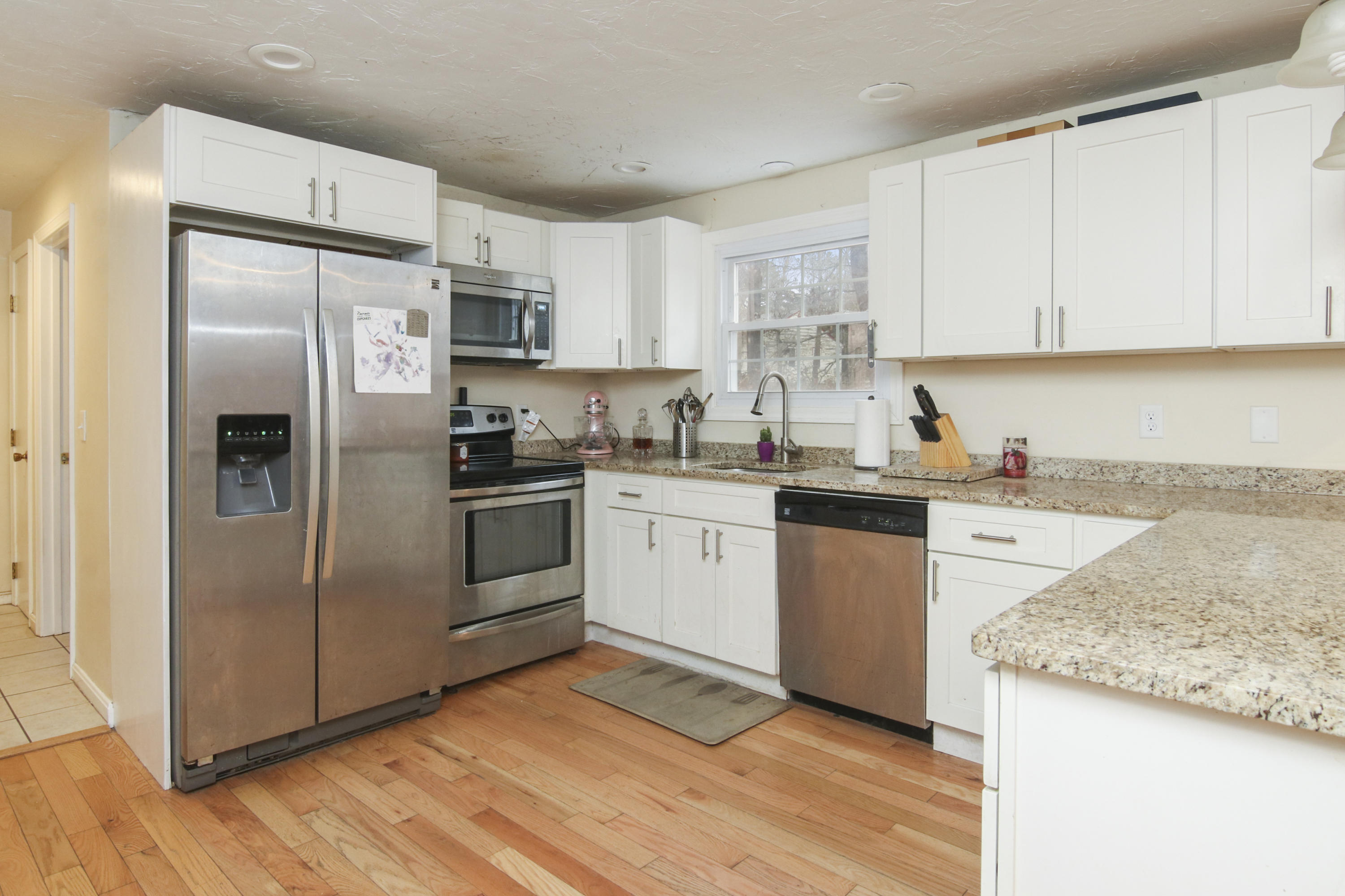 45 Blackthorn Path Forestdale, MA 02644 - Photo 7 of 19 a kitchen with a refrigerator sink and cabinets