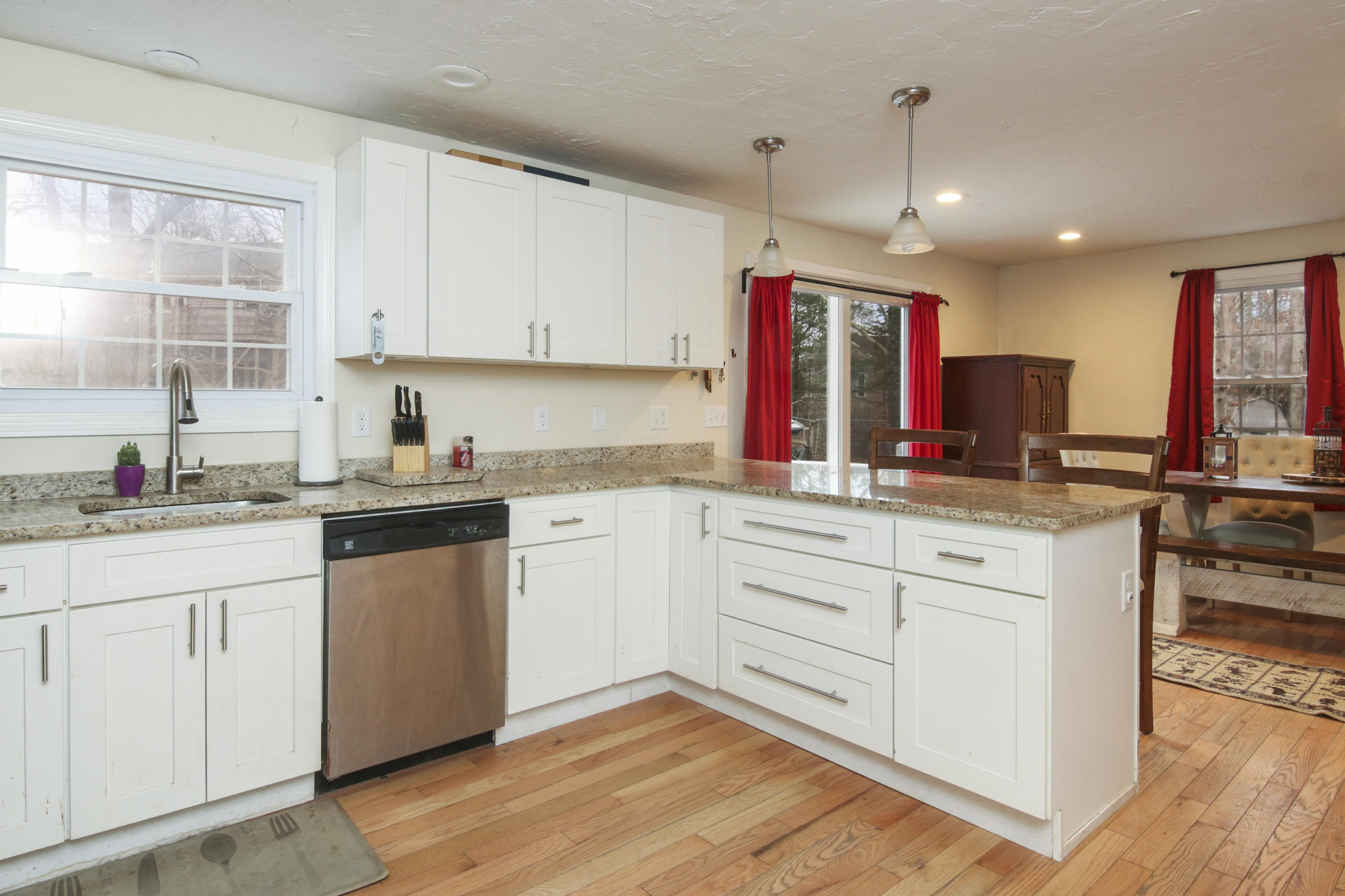 45 Blackthorn Path Forestdale, MA 02644 - Photo 8 of 19 a kitchen with granite countertop white cabinets and white appliances