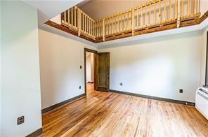 9502 Frankstown Road Penn Hills, PA 15235 - Photo 15 of 24 Master bedroom with a loft area above.