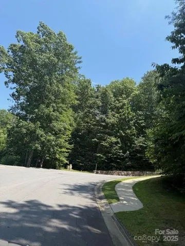 a view of a lake with a yard