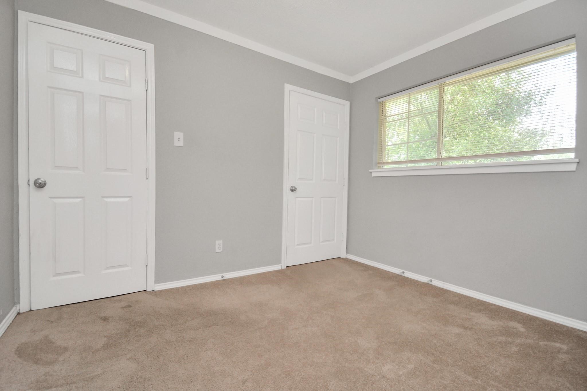 8622 Elbert Street, Unit B Houston, TX 77028 - Photo 13 of 21 an empty room with a window