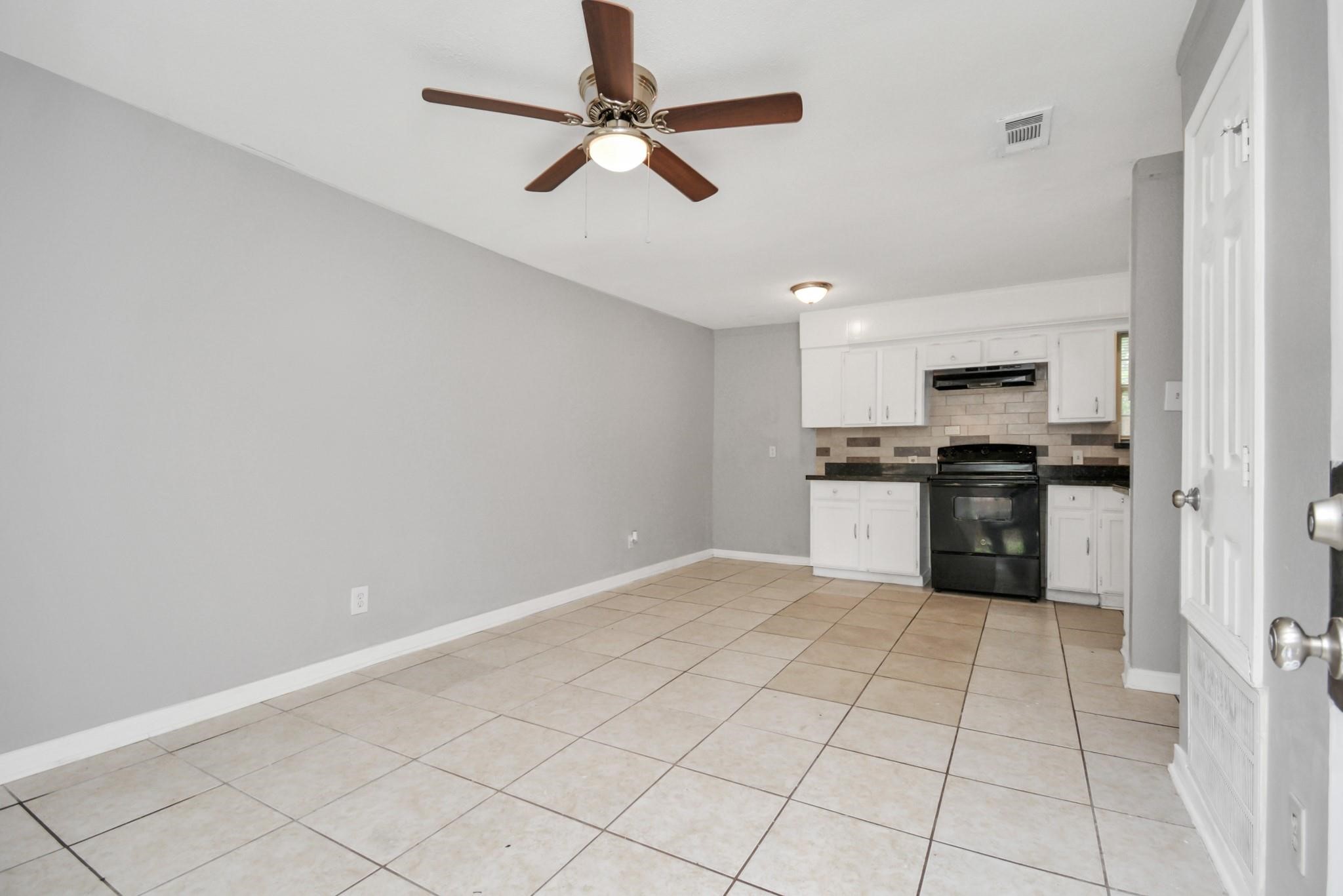 8622 Elbert Street, Unit B Houston, TX 77028 - Photo 4 of 21 a view of kitchen with granite countertop cabinets and stainless steel appliances