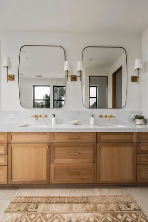 a spacious bathroom with a granite countertop sink and a mirror