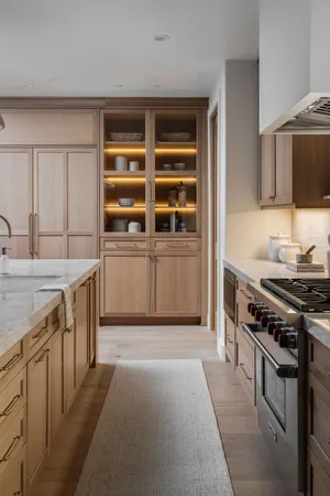 a kitchen with granite countertop a stove and a sink