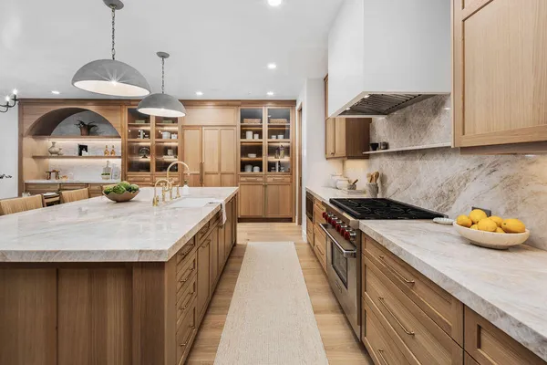 a kitchen with a sink a counter and cabinets