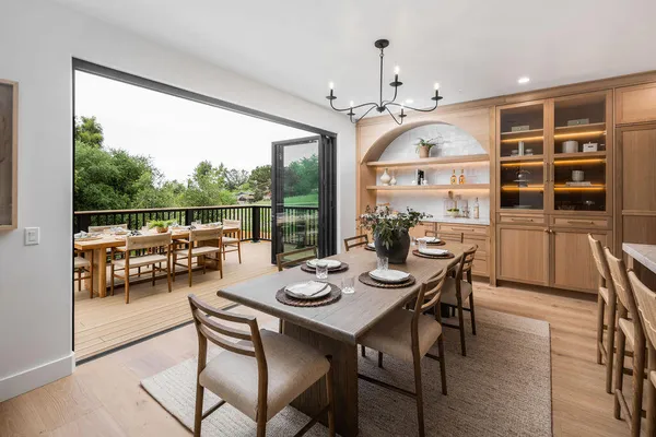 a view of a dining room with furniture and a window