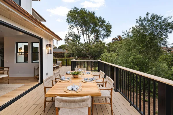 a view of a patio with a table and chairs