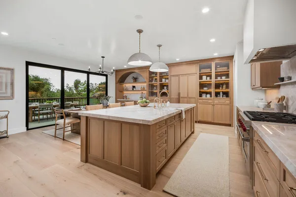 a kitchen with stainless steel appliances granite countertop a stove and a sink