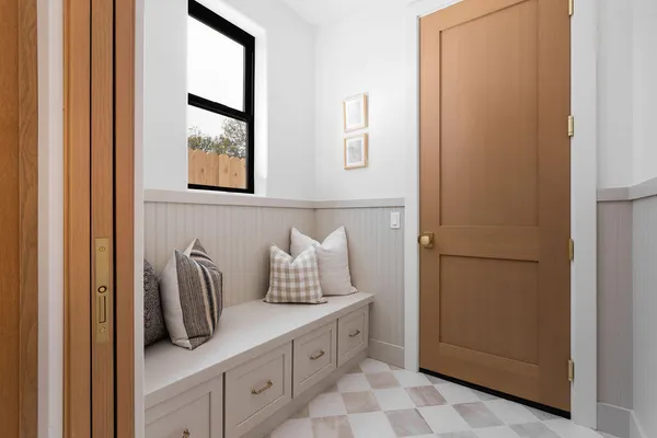 a kitchen with a refrigerator and window
