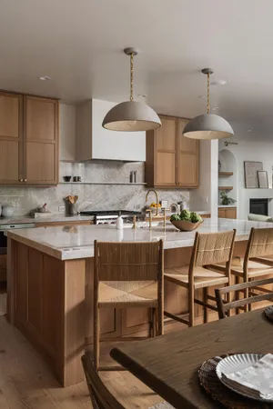 a kitchen with a table chairs stove and cabinets
