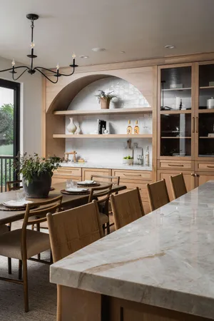 a kitchen with a table and chairs in it