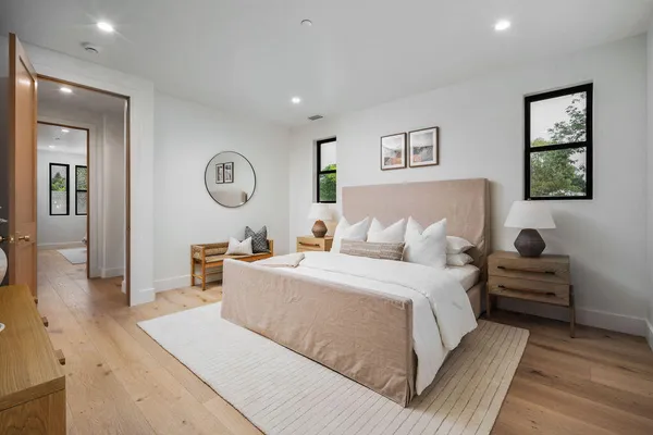 a bed room with a bed and a chair