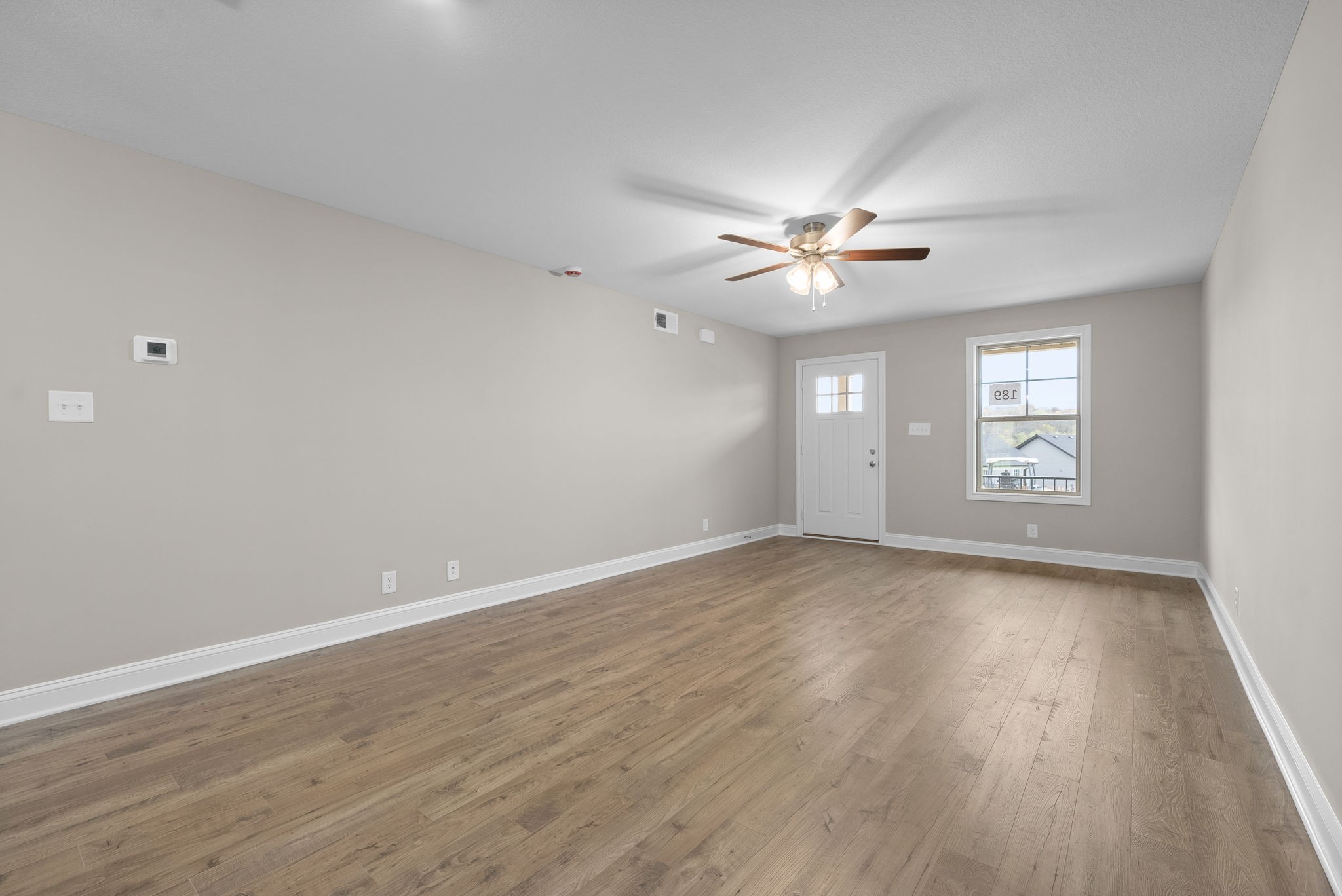 4 Echo Ridge Oak Grove, KY 42262 - Photo 4 of 29 a view of an empty room with a window and wooden floor