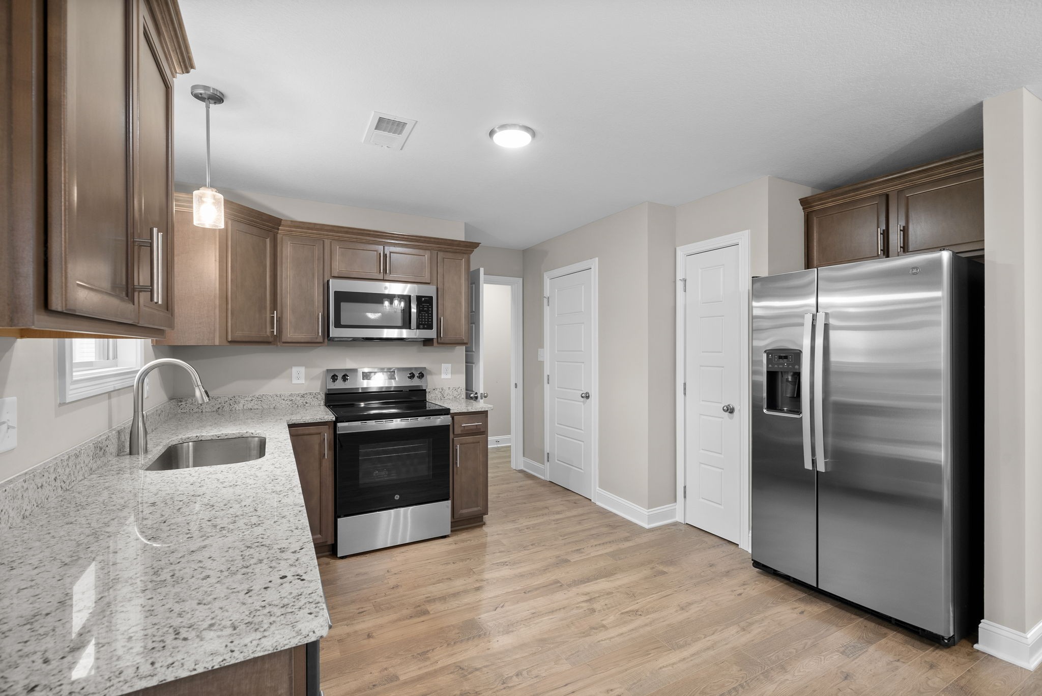 4 Echo Ridge Oak Grove, KY 42262 - Photo 8 of 29 a kitchen with stainless steel appliances granite countertop a refrigerator stove and sink