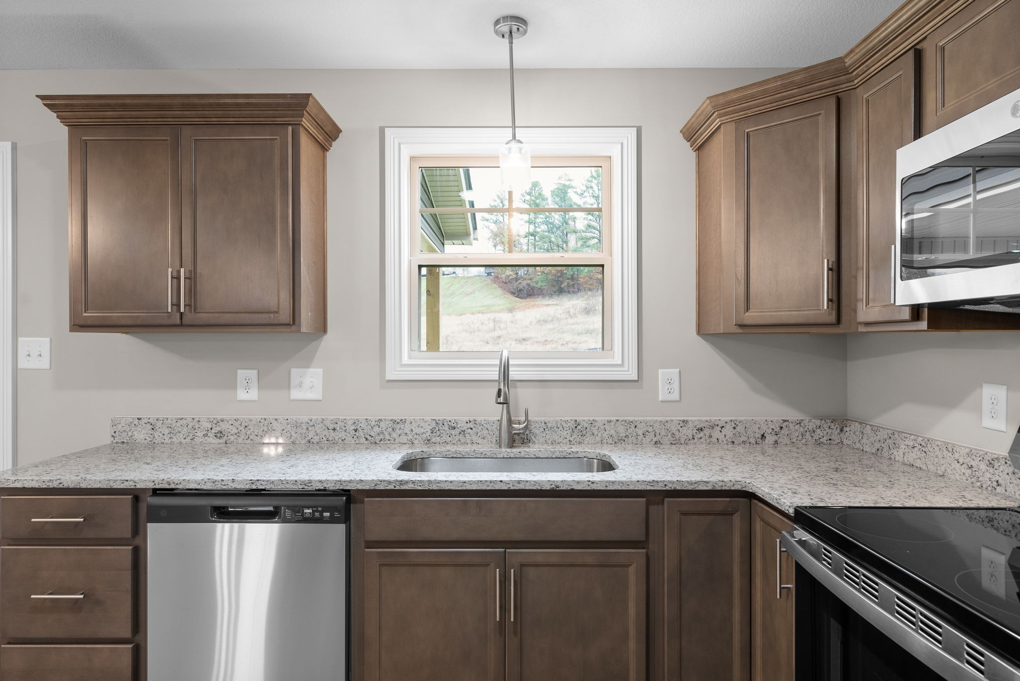 4 Echo Ridge Oak Grove, KY 42262 - Photo 9 of 29 a kitchen with granite countertop a sink and a window