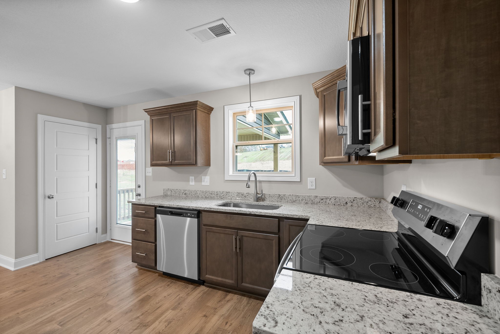 4 Echo Ridge Oak Grove, KY 42262 - Photo 10 of 29 a kitchen with stainless steel appliances granite countertop a sink stove and cabinets
