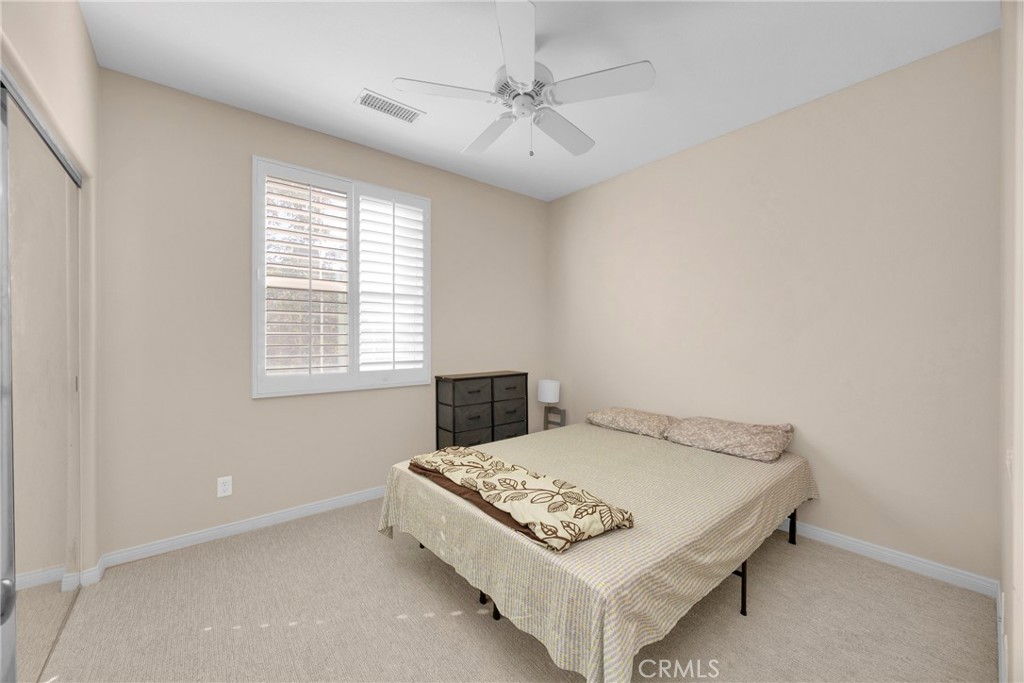 10 Agave Court Ladera Ranch, CA 92694 - Photo 17 of 36 a bedroom with a bed and a window