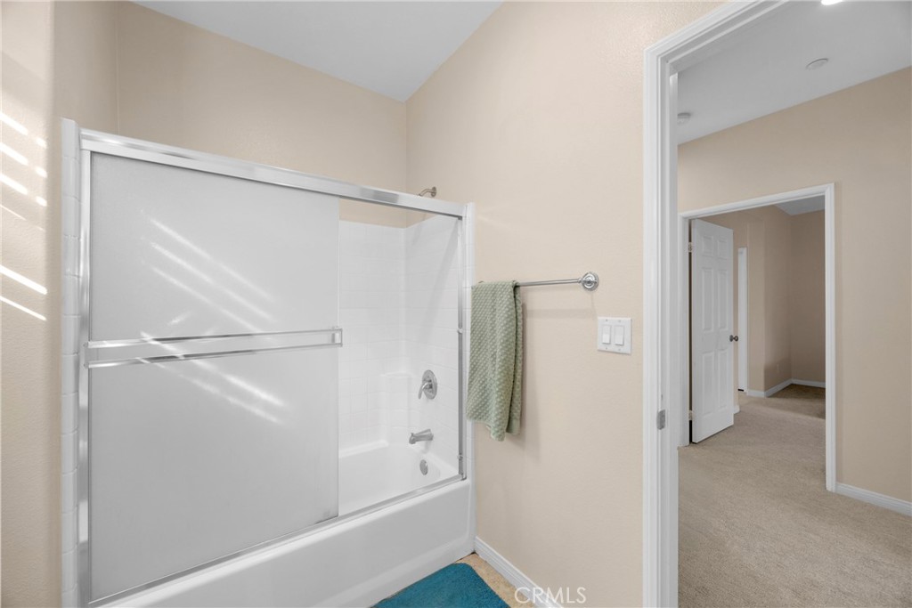 10 Agave Court Ladera Ranch, CA 92694 - Photo 20 of 36 a bathroom that has a glass shower door