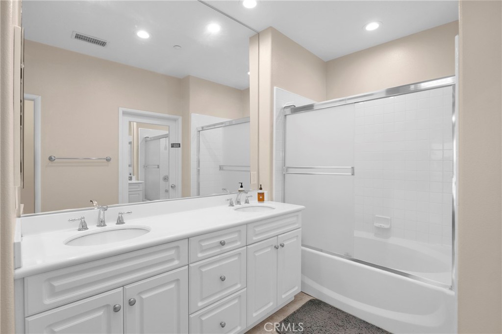 10 Agave Court Ladera Ranch, CA 92694 - Photo 23 of 36 a bathroom with a shower sink vanity granite and shower