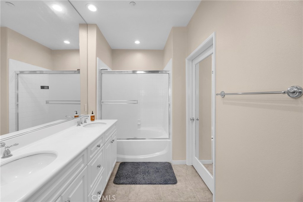 10 Agave Court Ladera Ranch, CA 92694 - Photo 24 of 36 a bathroom with a sink a toilet a mirror and shower