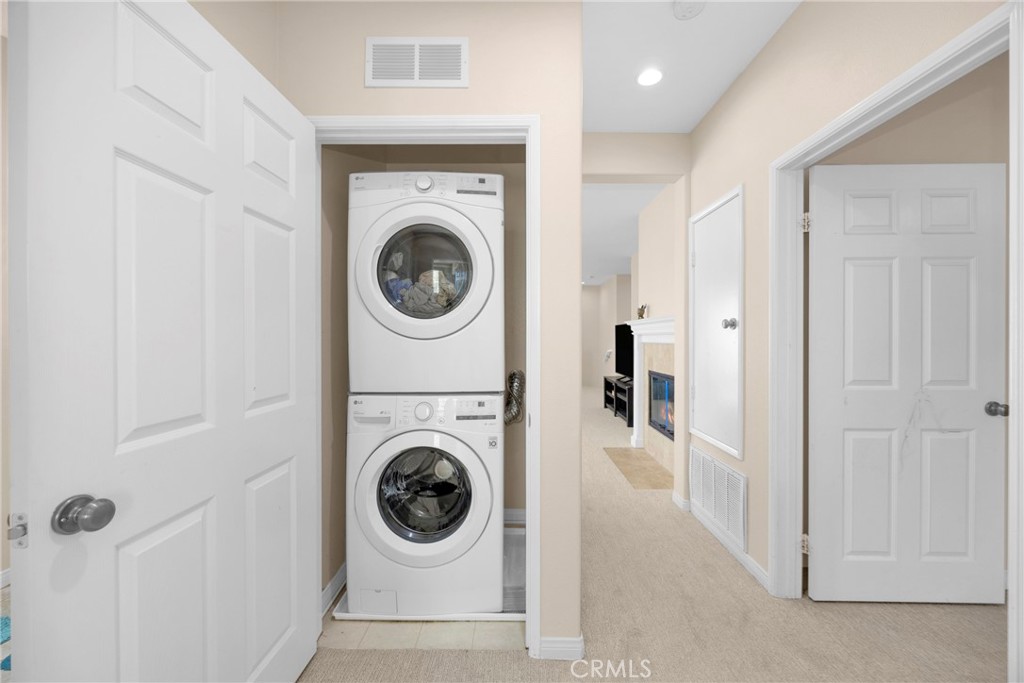 10 Agave Court Ladera Ranch, CA 92694 - Photo 30 of 36 a utility room with dryer and washer