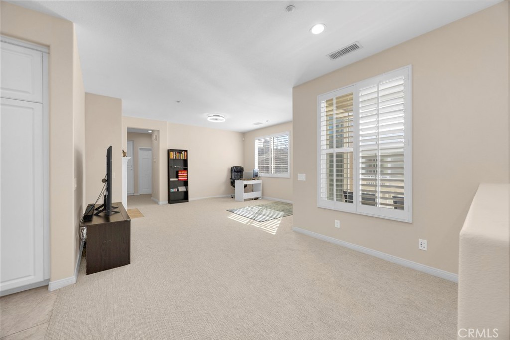 10 Agave Court Ladera Ranch, CA 92694 - Photo 5 of 36 a view of a livingroom with a furniture and floor to ceiling window