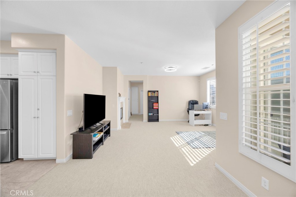 10 Agave Court Ladera Ranch, CA 92694 - Photo 6 of 36 a living room with furniture a flat screen tv and a window