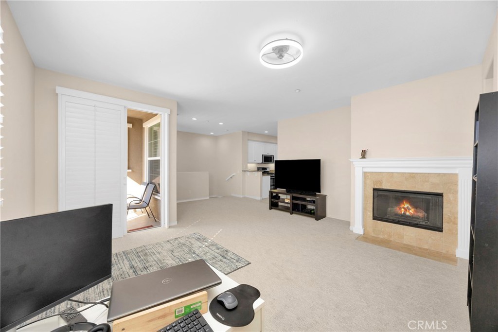 10 Agave Court Ladera Ranch, CA 92694 - Photo 9 of 36 a living room with furniture and a fireplace