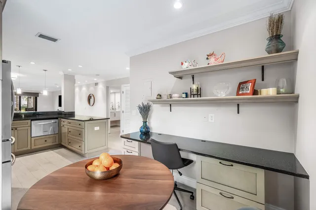 a bathroom with a toilet sink and shower
