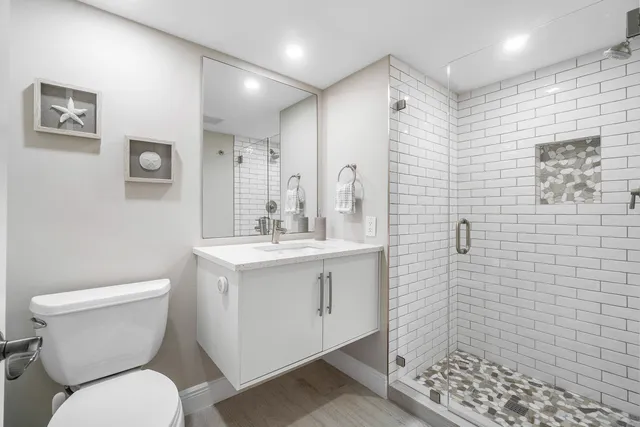 a bedroom with a large bed and a large window