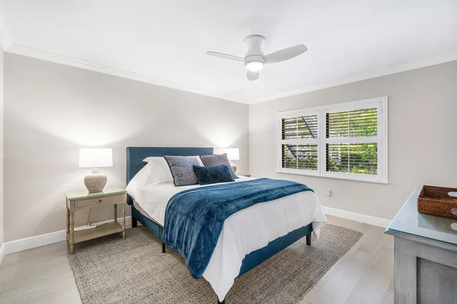 a bathroom with a granite countertop sink mirror and toilet