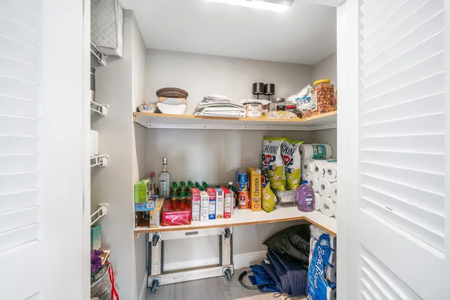 a view of a lake with houses in the back