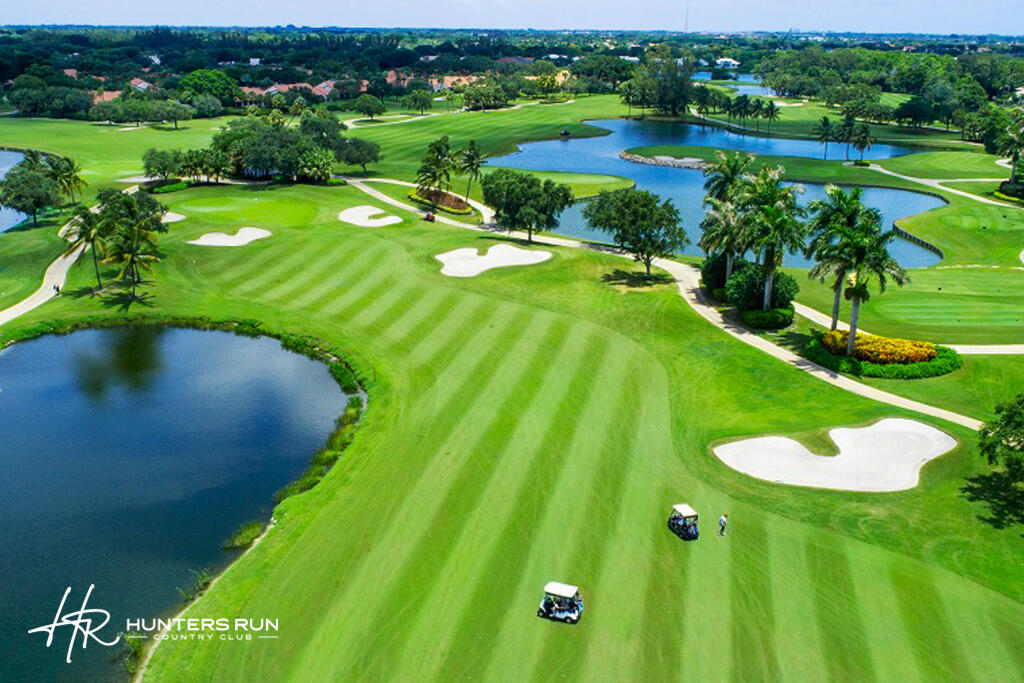 38 Southport Lane, Unit A Boynton Beach, FL 33436 - Photo 42 of 65 a view of a golf course with a lake view