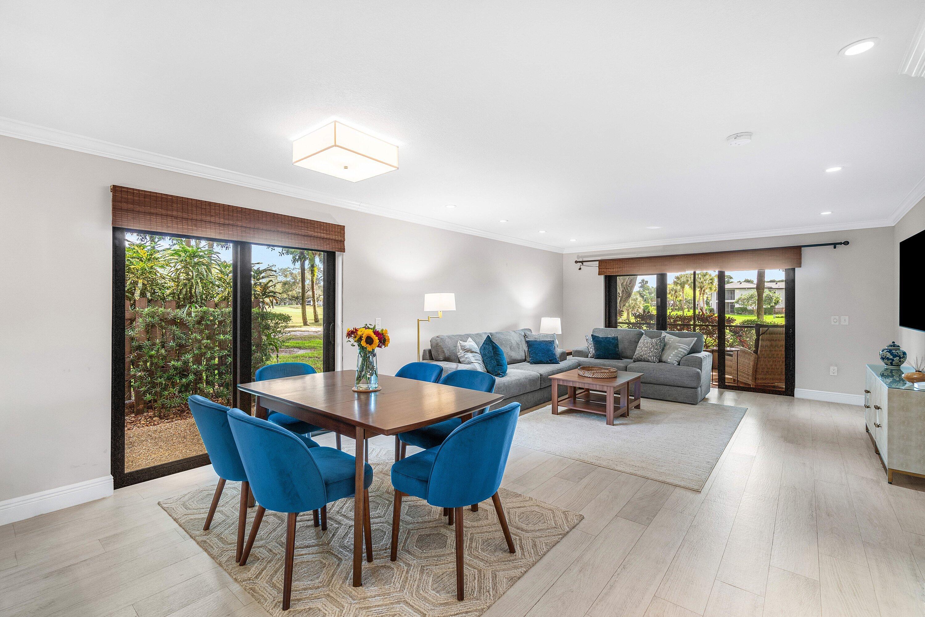 38 Southport Lane, Unit A Boynton Beach, FL 33436 - Photo 4 of 65 a living room with furniture and a large window